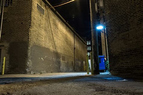 Dark And Scary Downtown Urban City Street Corner Alley With An Eerie
