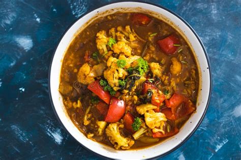 Plant Based Food Vegan Cauliflower And Capsicum Curry Dish With Indian