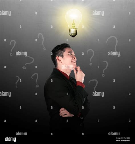 Business Man Thinking With Light Bulb Top Of His Head Stock Photo Alamy
