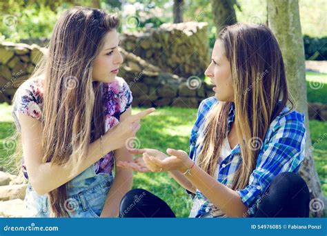 Unhappy Female Friends Arguing In Park Stock Image Image Of Teenage