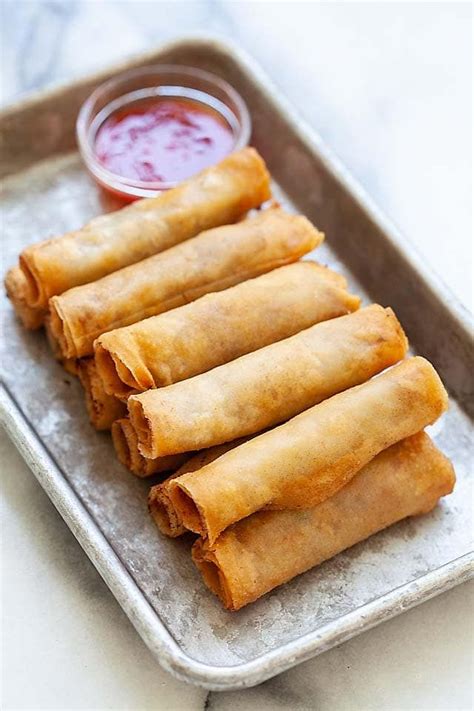lumpia or filipino fried spring rolls on a plate with lumpia sauce ready to be served spring
