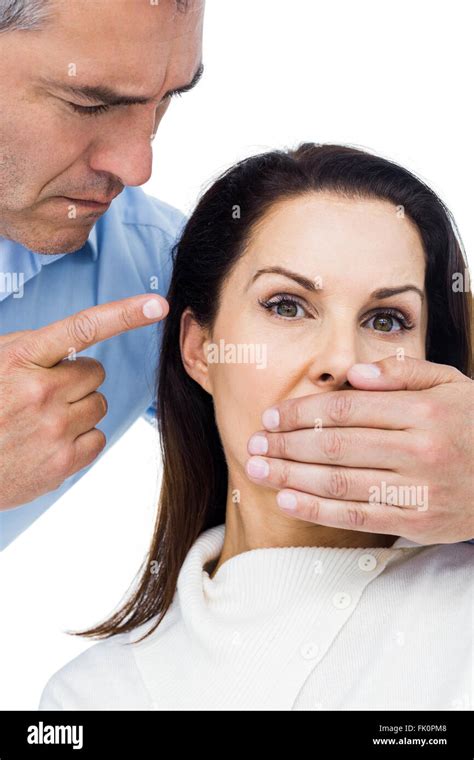 Man Covering Wifes Mouth Stock Photo Alamy