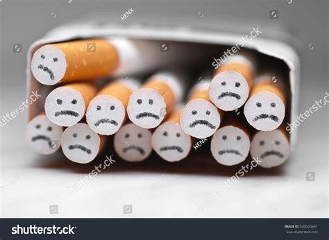 Sad Smile On Cigarette Stock Photo Edit Now 320020691