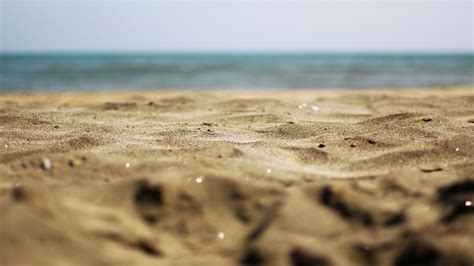 closeup view of beach sand in blur beach background hd sand wallpapers hd wallpapers id 72369