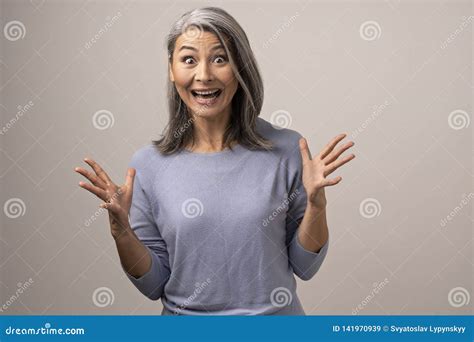 Beautiful Mature Woman Is Making Funny Faces Stock Image Image Of Cheerful Gray 141970939