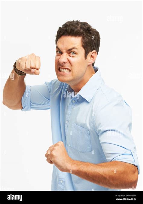 Losing His Cool An Angry Young Man With Fists Clenched Ready To Punch