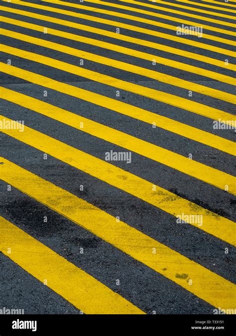 Yellow Stripes Painted On A Road Stock Photo Alamy