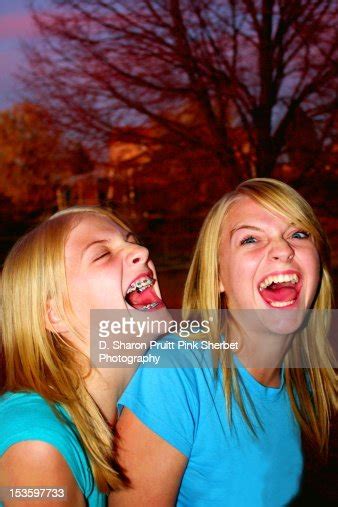 Two Girls Laughing High Res Stock Photo Getty Images