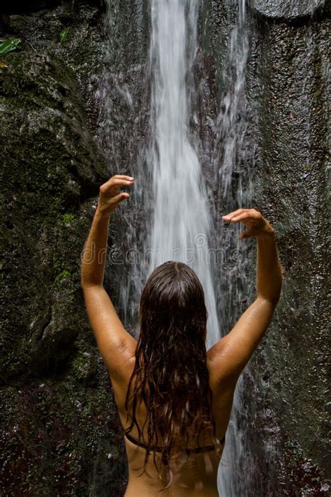 Refreshing Shower In A Serene Waterfall