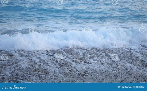 Pebble Beach With Foamy Mediterranean Sea Waves At Sunset Stock Video
