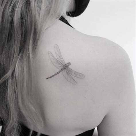 Micro Realistic Dragonfly Tattoo On The Shoulder Blade