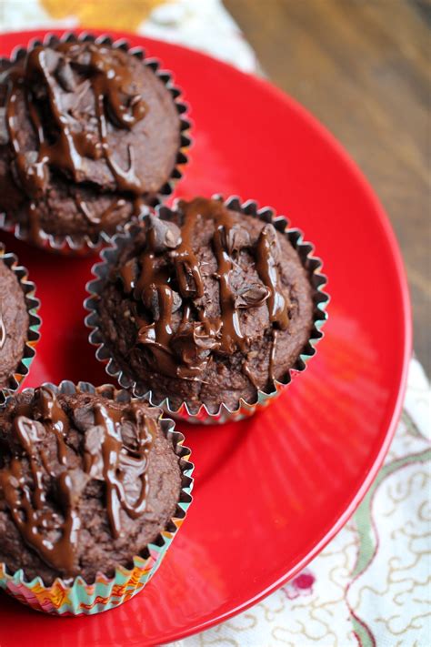 Vegan Chocolate Muffins With Chocolate Sauce On Top On Red Plate Double