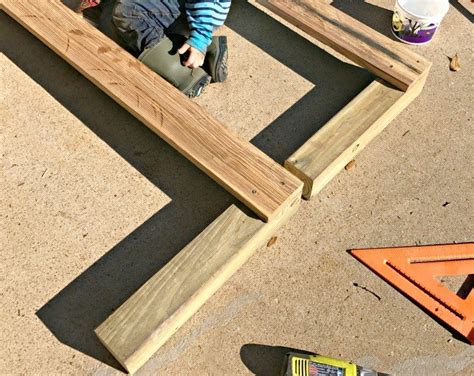 A Fun Pea Gravel Play Area And Backyard Activity Wall Abbotts At Home