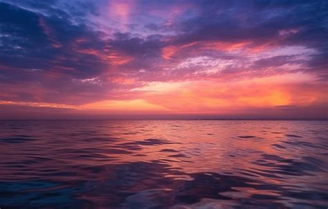 Premium Ai Image A Purple And Orange Sunset Over The Ocean