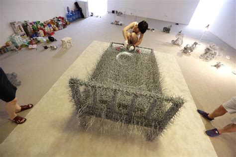 See Beijing Performance Artist Sleeps Naked On Iron Wire Bed For 36