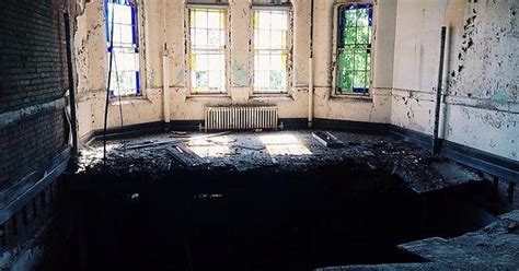 stained glass windows a massive hole in the floor abandoned state psychiatric hospital