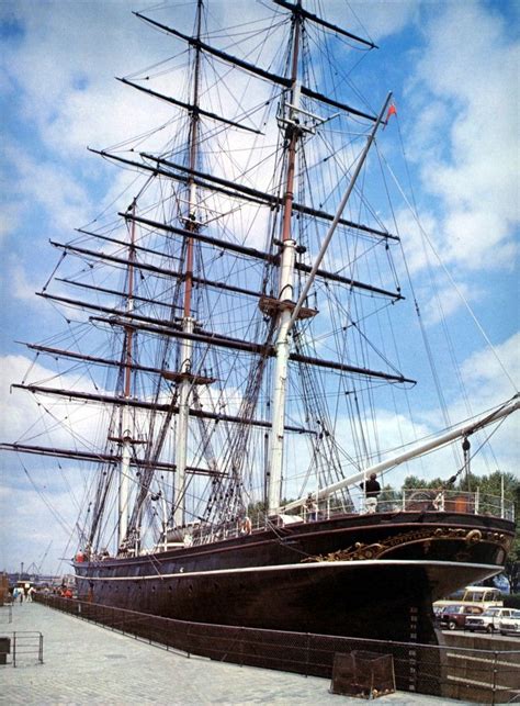 an old sailing ship is docked at the dock