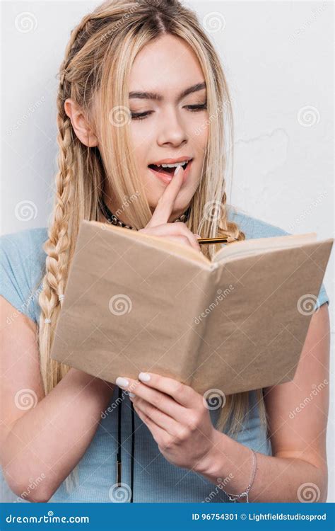 Caucasian Blonde Girl Reading Book In Thoughtful Pose Stock Image Image Of Tuition Casual