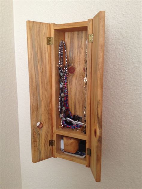 Interior Of Small Pine Wall Hung Jewelry Cabinet With Carved Necklace