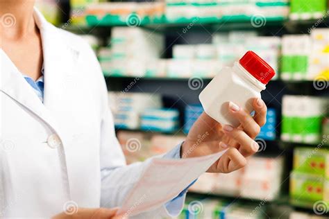 Female Pharmacist In Pharmacy With Medicament Stock Image Image Of