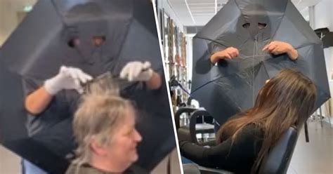 Hairdresser Creates Barrier Between Clients Using An Umbrella