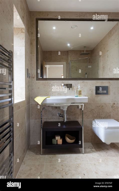 Luxury Bathroom With Mandarin Stone Tiling And Floor Stock Photo Alamy