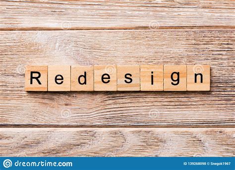 REDESIGN Word Written On Wood Block. REDESIGN Text On Wooden Table For Your Desing, Concept ...