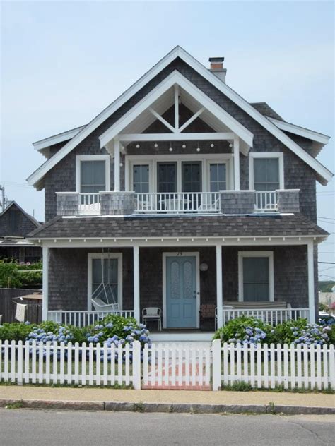Grey Shingle Style Beach House With 2 Storey Porch And Porch Swing