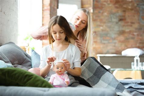 Mother And Daughter Sisters Have Quite Beauty And Fun Day Together At Home Comfort And