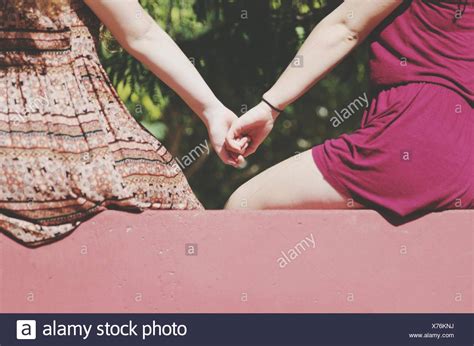 Rear View Of Friends Holding Hands Stock Photo 279815694 Alamy