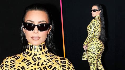Kim Kardashian Struggles To Walk In Catsuit Covered In Balenciaga Caution Tape Kim Kardashian