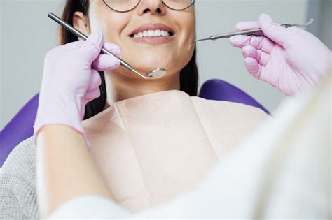 Premium Photo A Woman Is Preparing For A Dental Examination Woman Having Teeth Examined At