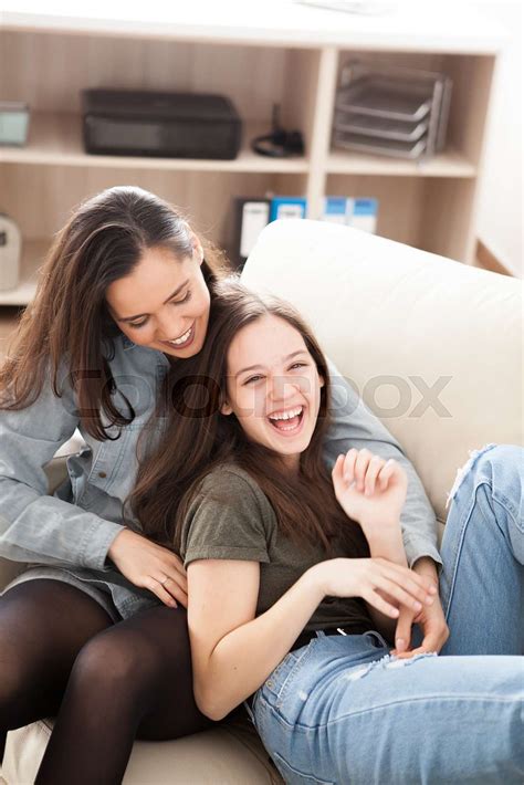 The Oldes Sister Is Cuddling The Younger One Stock Image Colourbox