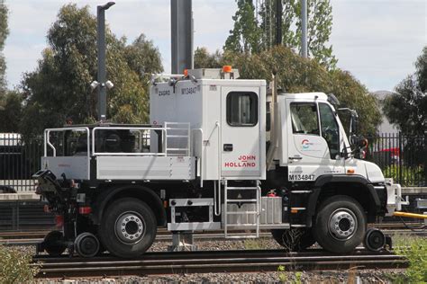 Unimog Hi Rail Truck Delivers Overhead Components To The Worksite At