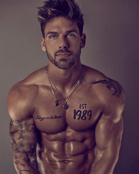 Handsome Sexy Muscular Male With Various Tattoos On Naked Torso And