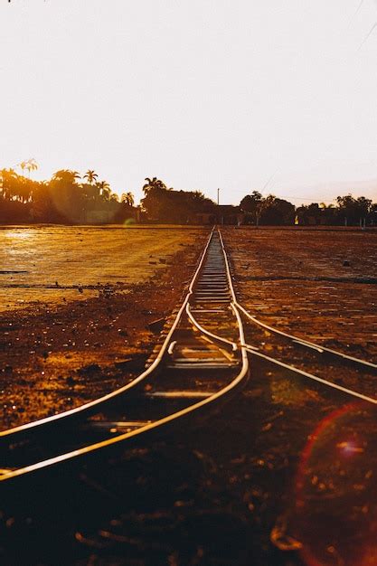 Premium Photo Railway Tracks At Dusk Photo