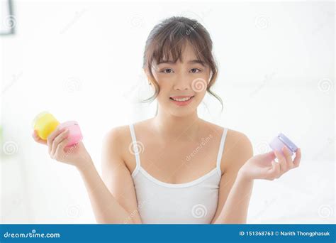 Beautiful Portrait Young Asian Woman Attractive Holding Jars Of Cream And Lotion Skin For Face