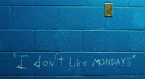A Blue Wall With Writing On It That Says I Don T Like Mondays
