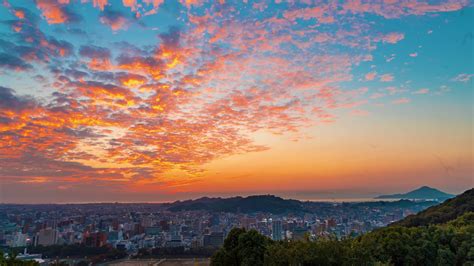 Sunset time-lapse of the Matsuyama City skyline in Japan Stock Video 