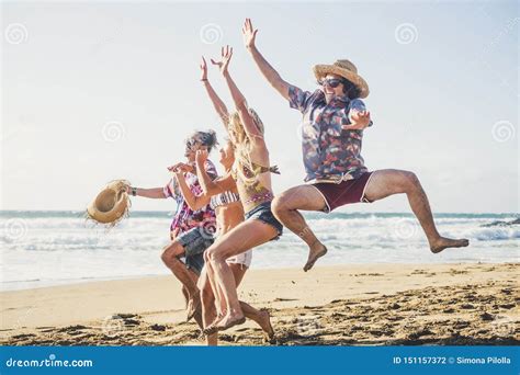 Happiness And Joy For Young People On Vacation At The Beach Enjoy