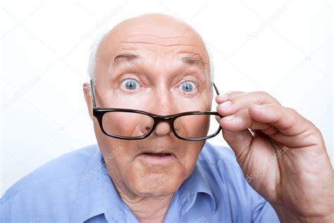 Surprised Grandfather Holding Glasses — Stock Photo © Yacobchuk1 74599123