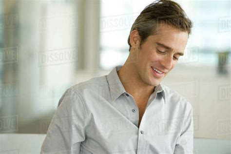 Man Looking Down And Smiling Portrait Stock Photo Dissolve
