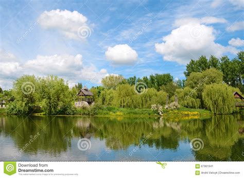 Fairytale Landscape With Pond And Beautiful Clouds On A Sunny Da Stock