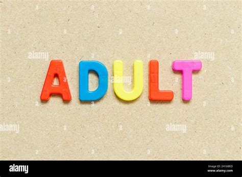 Color Alphabet Letter With Word Adult On Wood Background Stock Photo