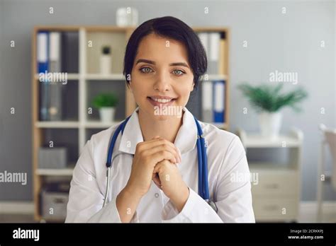 Friendly Young Doctor Looking At Camera During Online Consultation In
