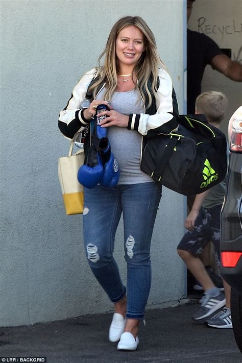 heavily pregnant hilary duff looks glowing as she steps out in gray t shirt and ripped jeans