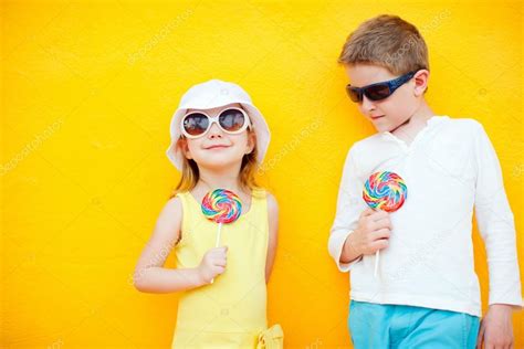 Kids With Lollipops — Stock Photo © Shalamov 13548464