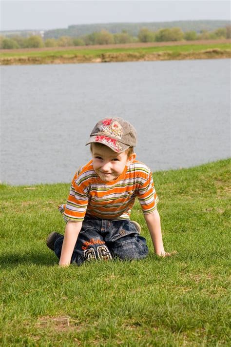 Little Boy Walks Around The Lake Stock Photo Image Of Youth Rest