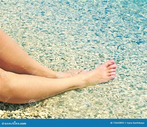 Female Feet On A Beach Against The Sea In A Summer Sunny Day Stock Image Image Of Beautiful