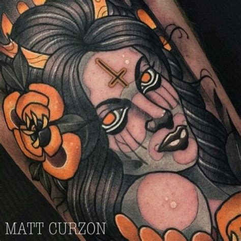 A Close Up Of A Tattoo On A Persons Leg With An Image Of A Woman